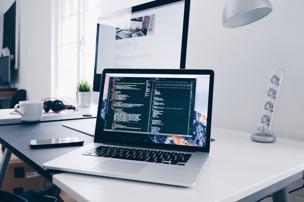 Developer editing a robots. Txt file on a laptop